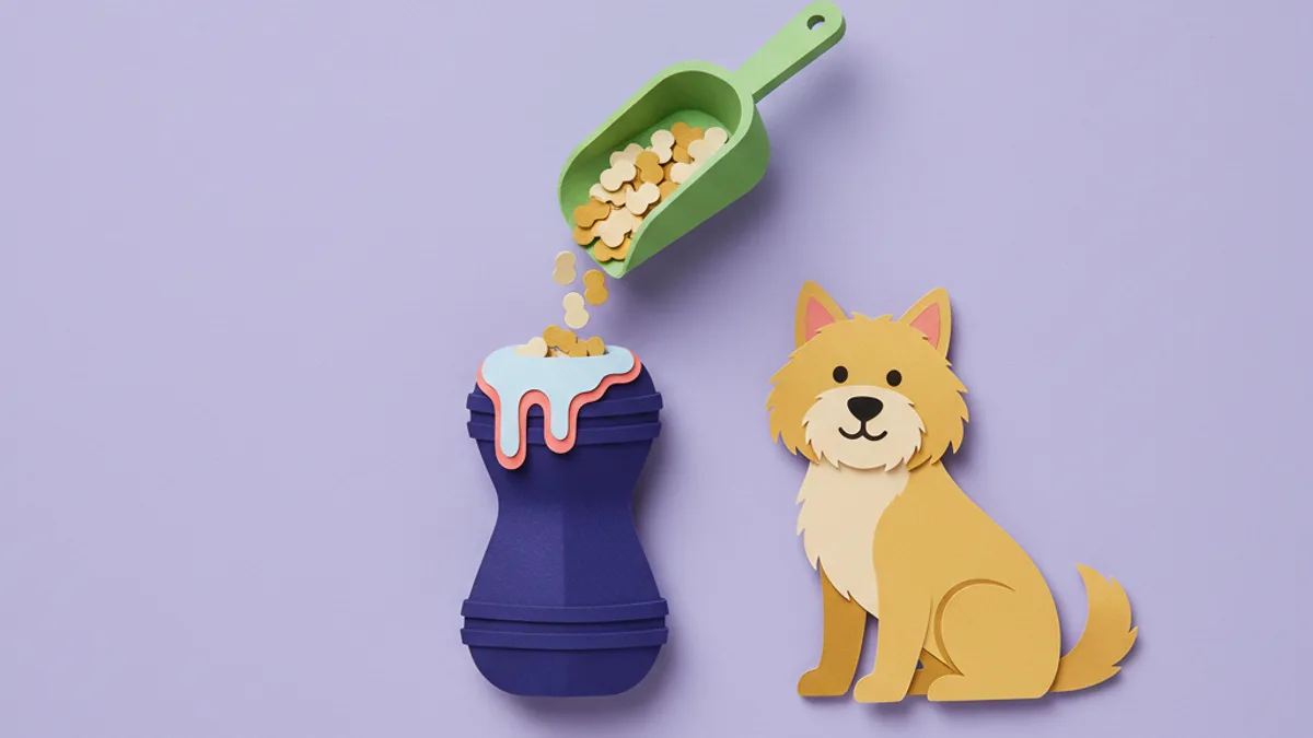 Paper-craft rubber enrichment toy being filled with the dog's frozen prescription diet as a trial-safe long-lasting treat